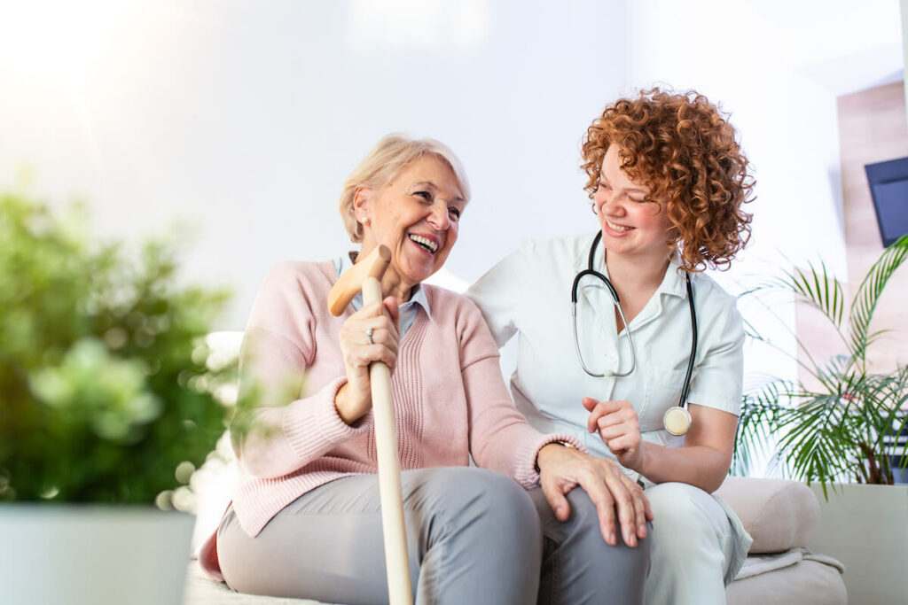 Proveer at Quail Creek | Senior woman and her caregiver laughing together